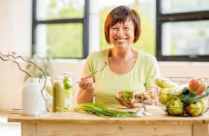 Happy woman enjoying healthy food
